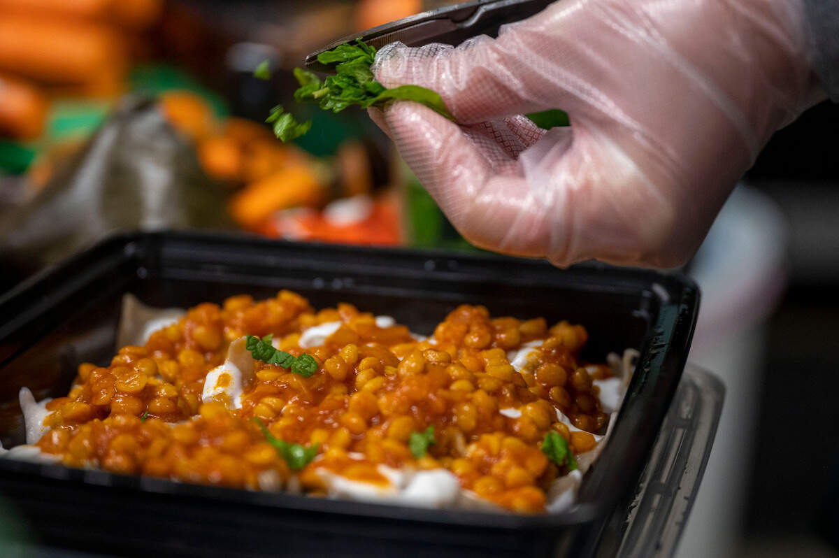Jazze’s serves traditional Afghani dumplings, ashak and mantu, here topped with lentils in tomato sauce and garnished with mint, at Spice Bridge Food Hall in Tukwila, Washington.