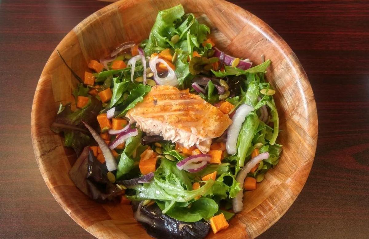 The salmon salad comes with pumpkin seeds and diced roasted sweet potatoes at Garden Bar in Tacoma.