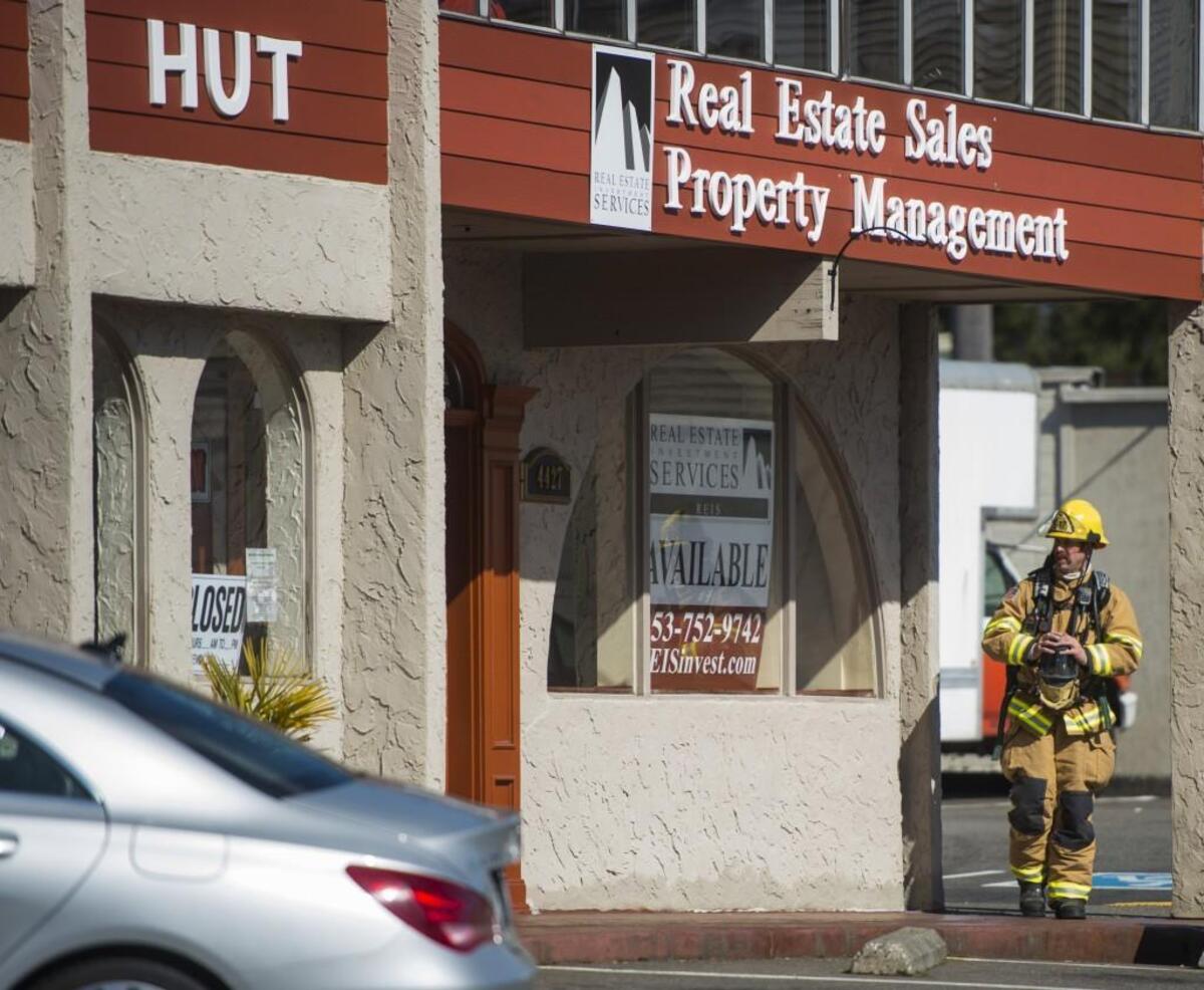 Tacoma firefighters mop up the scene at the Da Tiki Hut, a Hawaiian restaurant which suffered a kitchen fire on Monday, March 19, 2018. The restaurant is known for classic Hawaiian fare, such as poke and loco moco. The restaurant opened in Tacoma’s Sixth Avenue neighborhood in 2014.