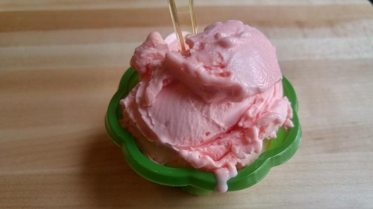 A single scoop of pink guava sorbetto, which is dairy free, from Alegre Bakery and Gelato in the Proctor neighborhood.