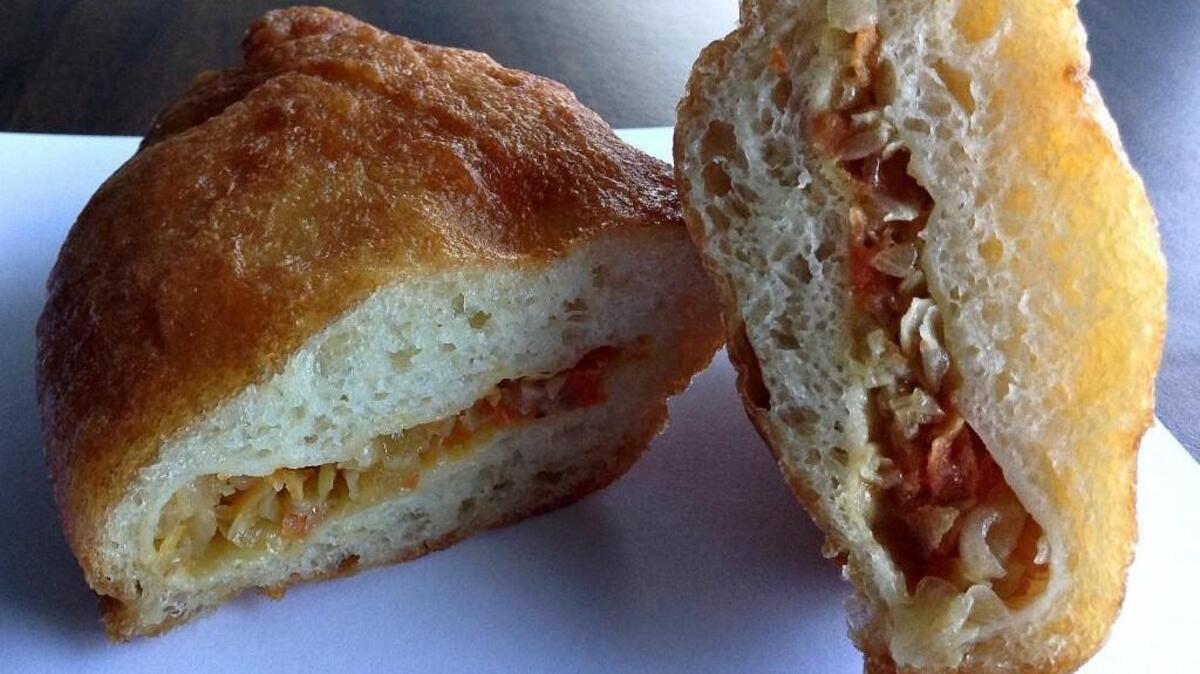 Find at least a half dozen varieties of piroshki in the serve-yourself case at Friendly Foods, an Eastern European grocery store on Center Street in Tacoma. This piroshki is filled with cabbage.