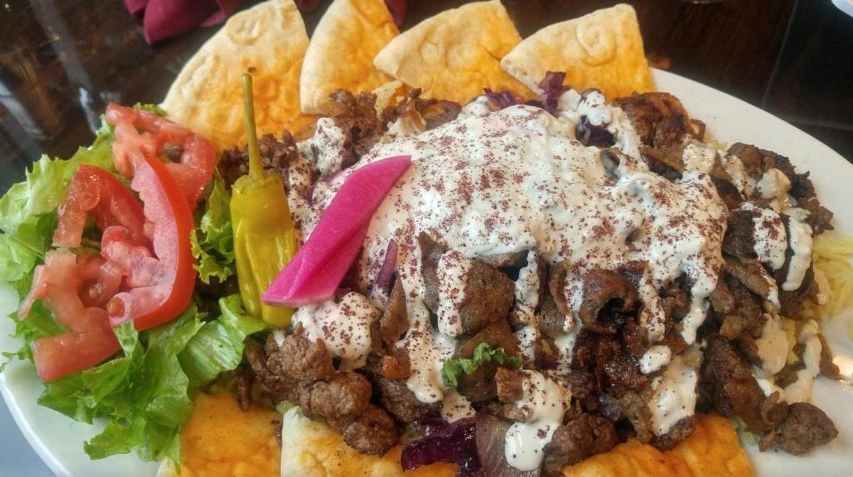 A platter of lamb shawarma with salad, rice and pita from Mediterranean Gyro Grill.