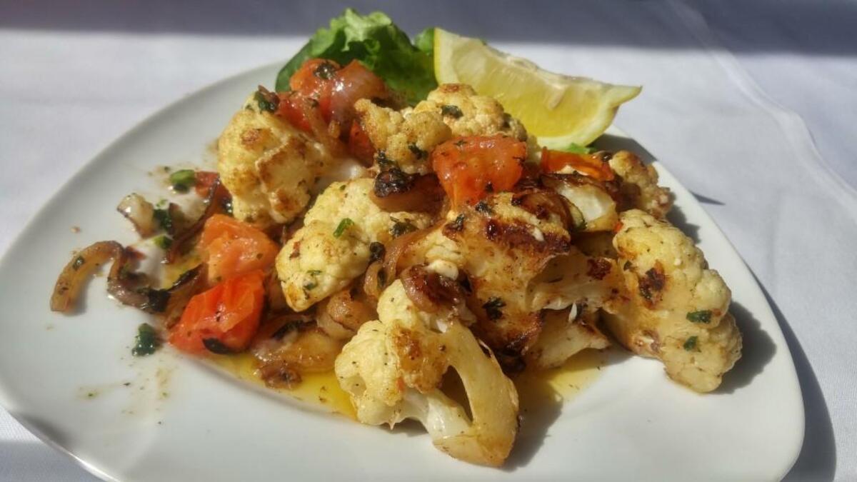 Spicy sauteed cauliflower is served with a tomato, onion, garlic, lemon and feta sauce at Toscanos Italian Grill in Puyallup.