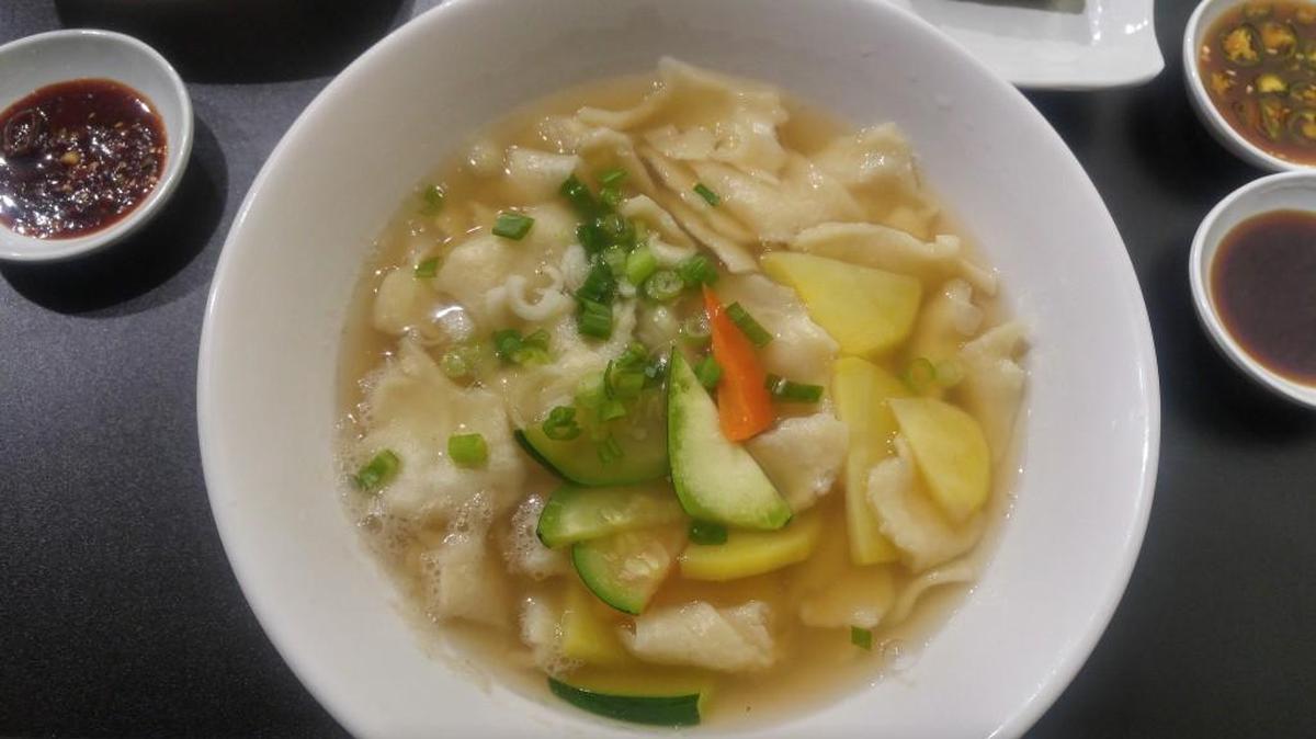 A bowl of hand-torn noodle soup from Song Song Restaurant in Lakewood’s Korean dining district.