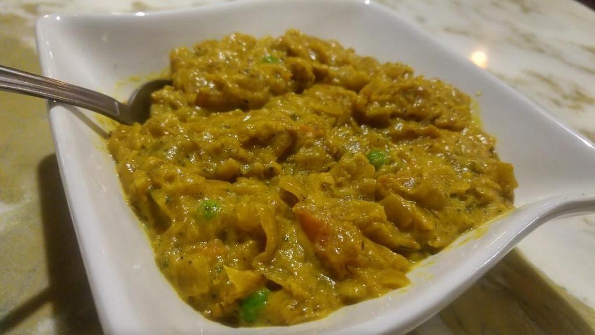 Eggplant bharta is prepared as a creamy, spiced eggplant dish at Karma Indian Cuisine in South Hill.