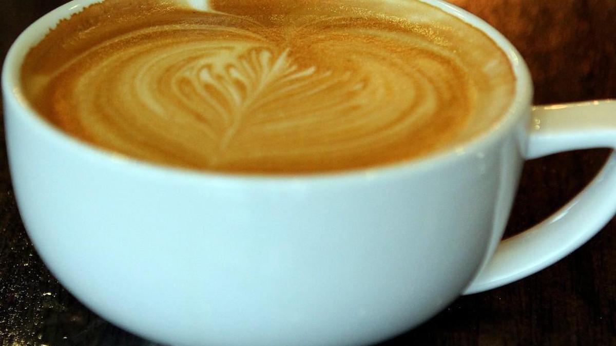 An espresso drink awaits its customer with an artistic leaf pattern made by Markee co-owner Courtney Marshall.