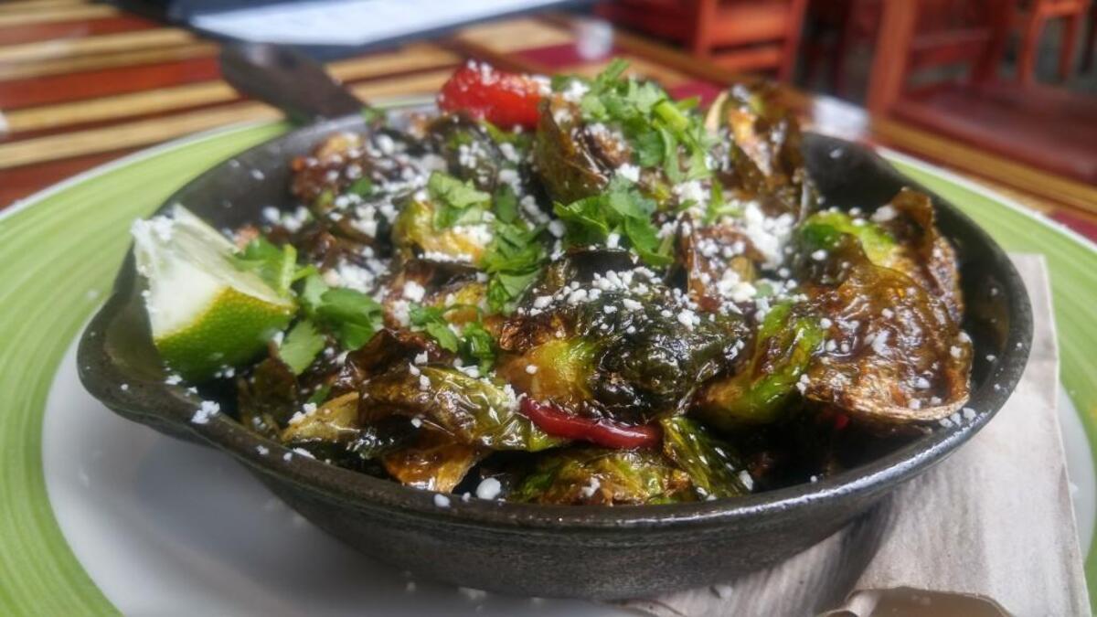 A side dish of Brussels sprouts at Matador in downtown Tacoma are flavored with lime and cotija cheese.