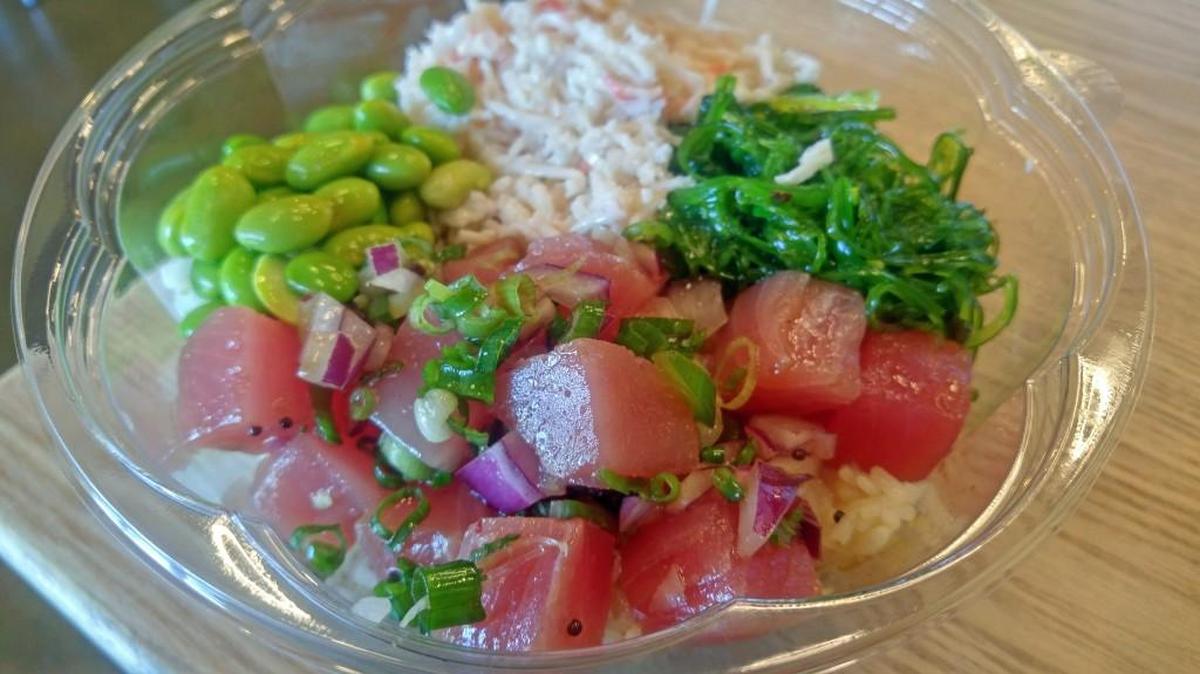 A tuna poke bowl with edamame, surimi and seaweed. The bowls come with raw or cooked fish.