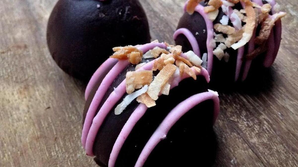 Truffles are chocolate dipped at Corina Bakery in Tacoma. These are coconut and praline.