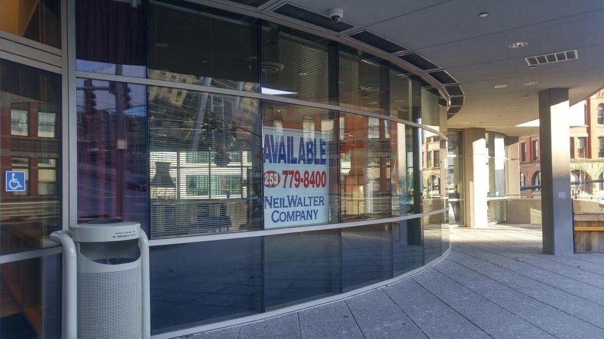 A sign in the window at Aviateur announces that the space is available.