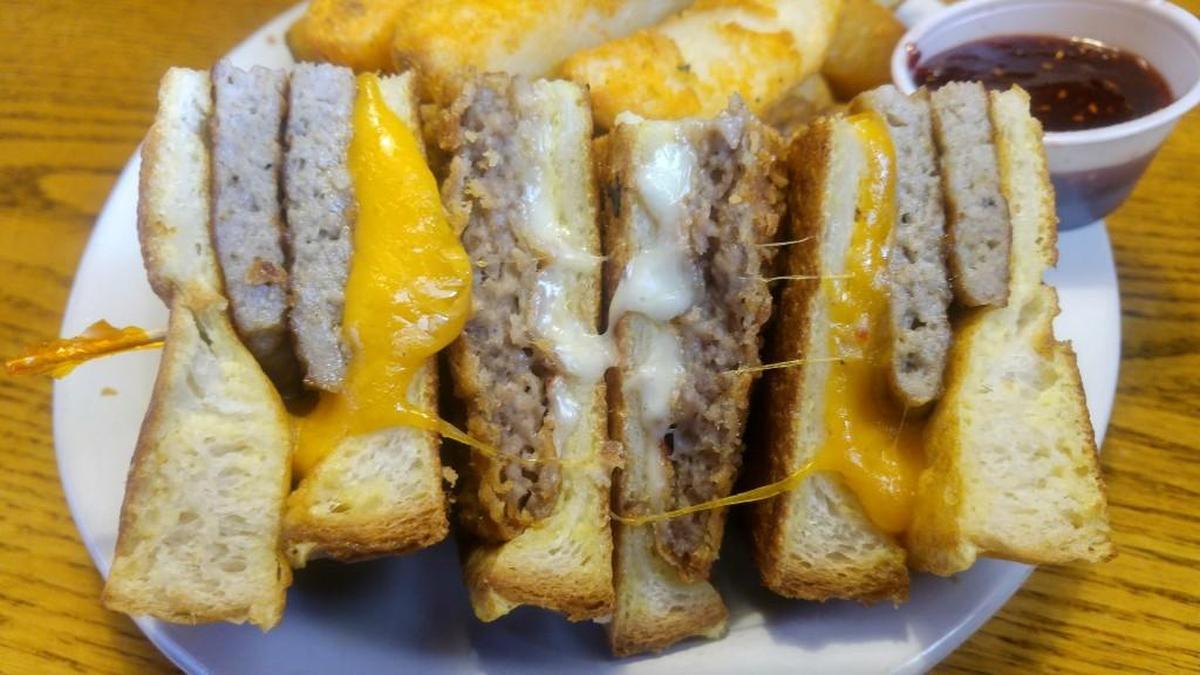 A chicken fried steak and sausage version of a Monte Cristo sandwich comes with Swiss and cheddar cheeses at the Homestead Restaurant and Bakery.