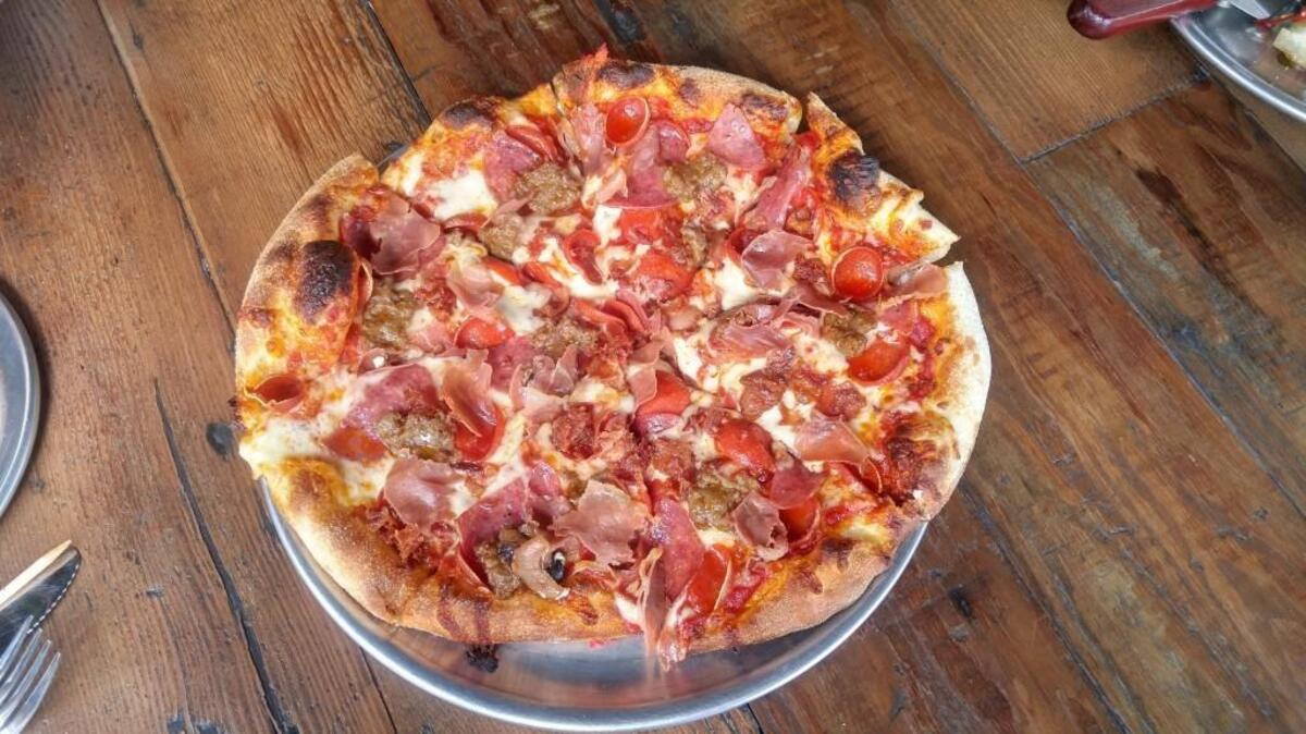 A Flying Pig pie at Wicked Pie Pizza comes with five kinds of pork: Prosciutto, bacon, sausage, pepperoni and salami.