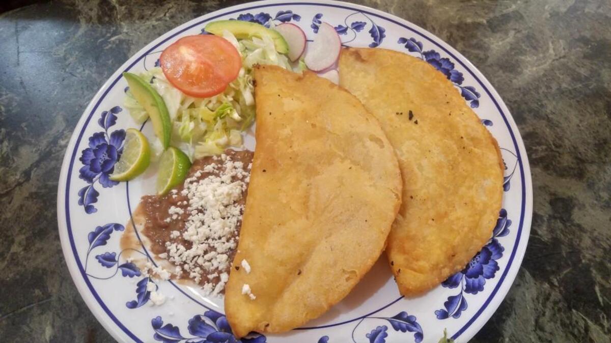 Oaxacan style empanadas, one with Oaxacan cheese and the other with slow-cooked shredded chicken, from Restaurant Casa Mixteca in Lakewood.