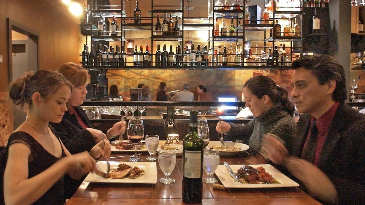 The Ritchies, Allison, Janet, Meredith and Mike dig in to Argentine-influenced cuisine at Asado, a restaurant on Sixth Avenue.