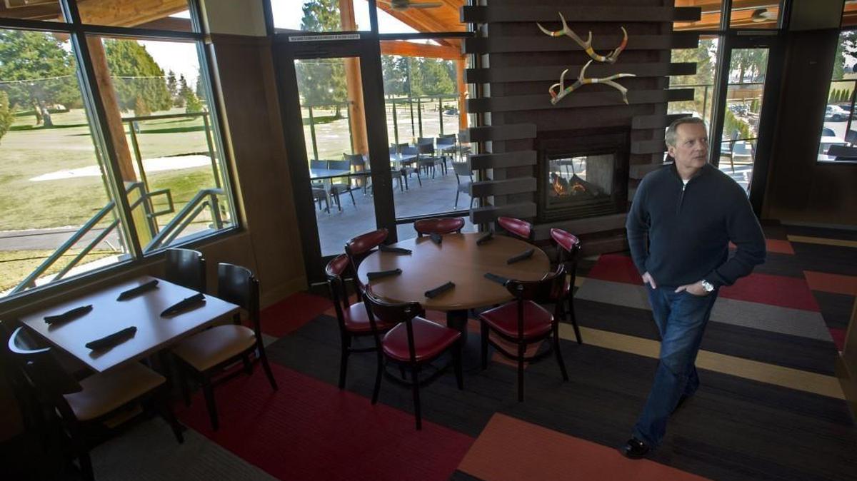 Gordon Naccarato looks over his newest restaurant, Smoke + Cedar, at Allenmore Golf Course in Tacoma on Friday, Feb. 28, 2014, just before the restaurant opened for business. Outside of the dining area is Allenmore Golf Course. The restaurant will close for business on Sunday (Nov. 1).