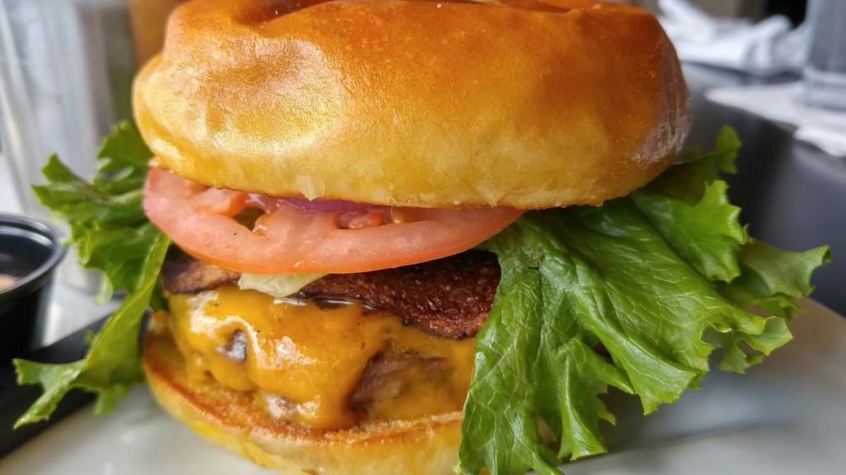 NYP Bar and Grill serves hand-pressed burgers that its menu identifies as beef from Columbia Valley. Pictured here is a bacon cheesebuger.