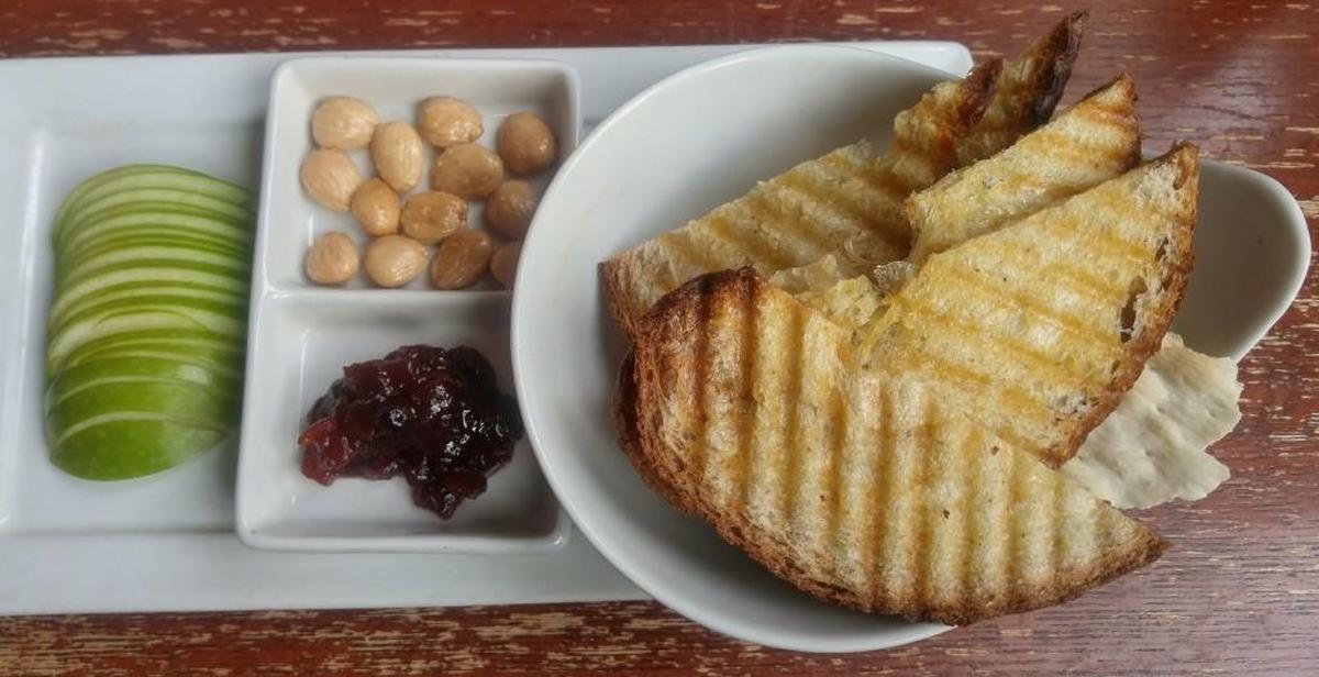 A second plate accompanies the cheese at 208 Garfield. Grilled bread, salted marcona almonds, sliced apple and beet chutney are included.
