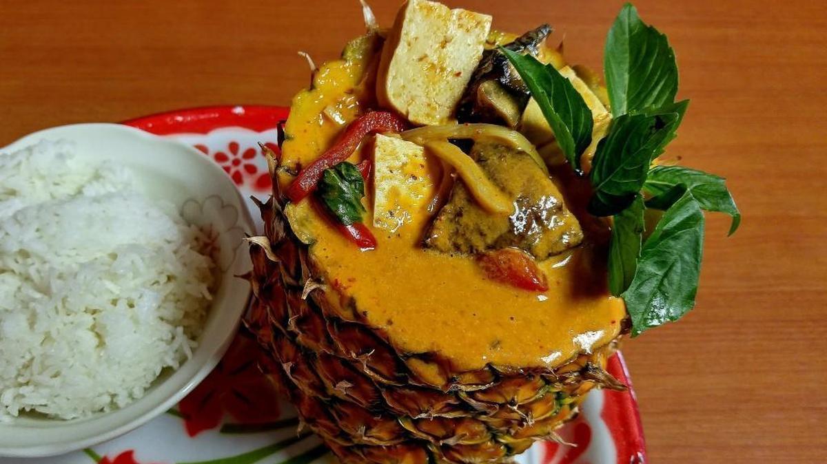 Thai curry is served in a hollowed pineapple at Loak Toung Thai, newly opened on Center Street in Tacoma.
