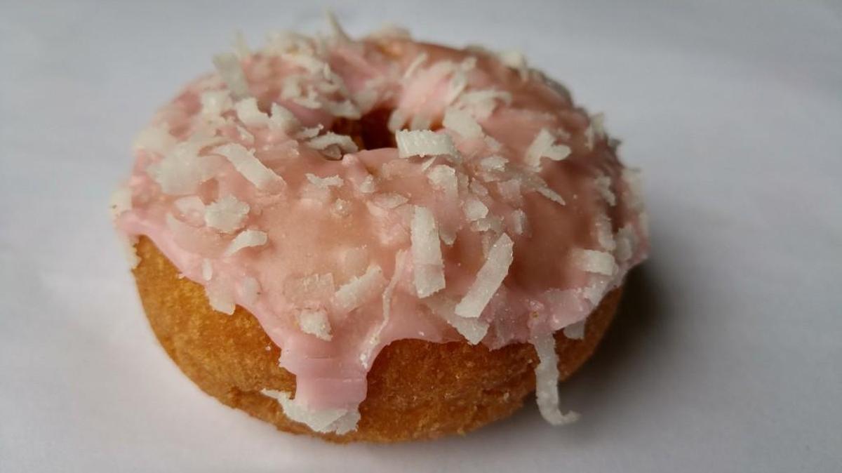 A cake doughnut with a coconut frosting from Yummies Donuts in Tacoma.