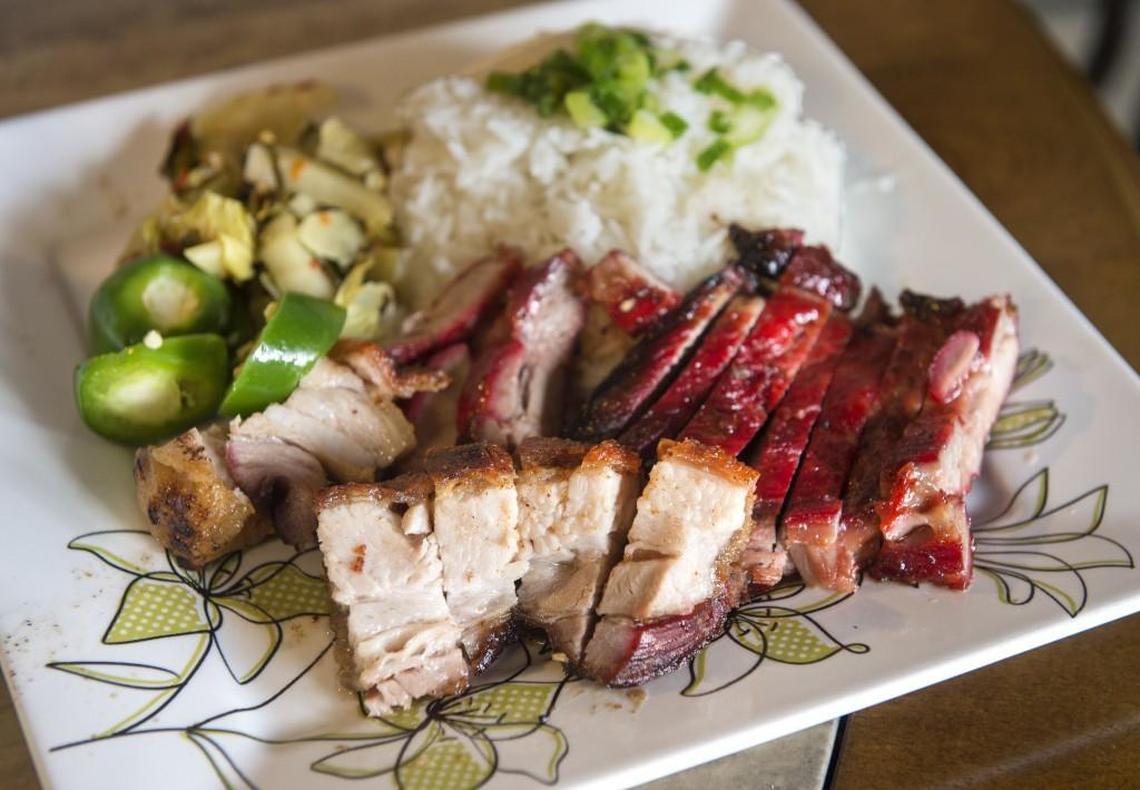 A typical lunch plate of barbecue pork, roast pork, jalapeños, pickled vegetable and rice at Tho Tuong B.B.Q., on 38th Street in Tacoma.
