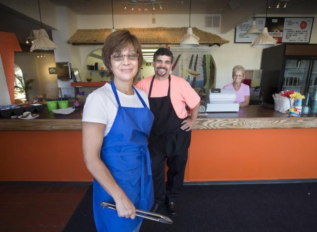 Owners Tamara Lerma and her husband, Steve, with Steve’s mom, Jan Settle, right, run the family business at Da Tiki Hut on Sixth Avenue.