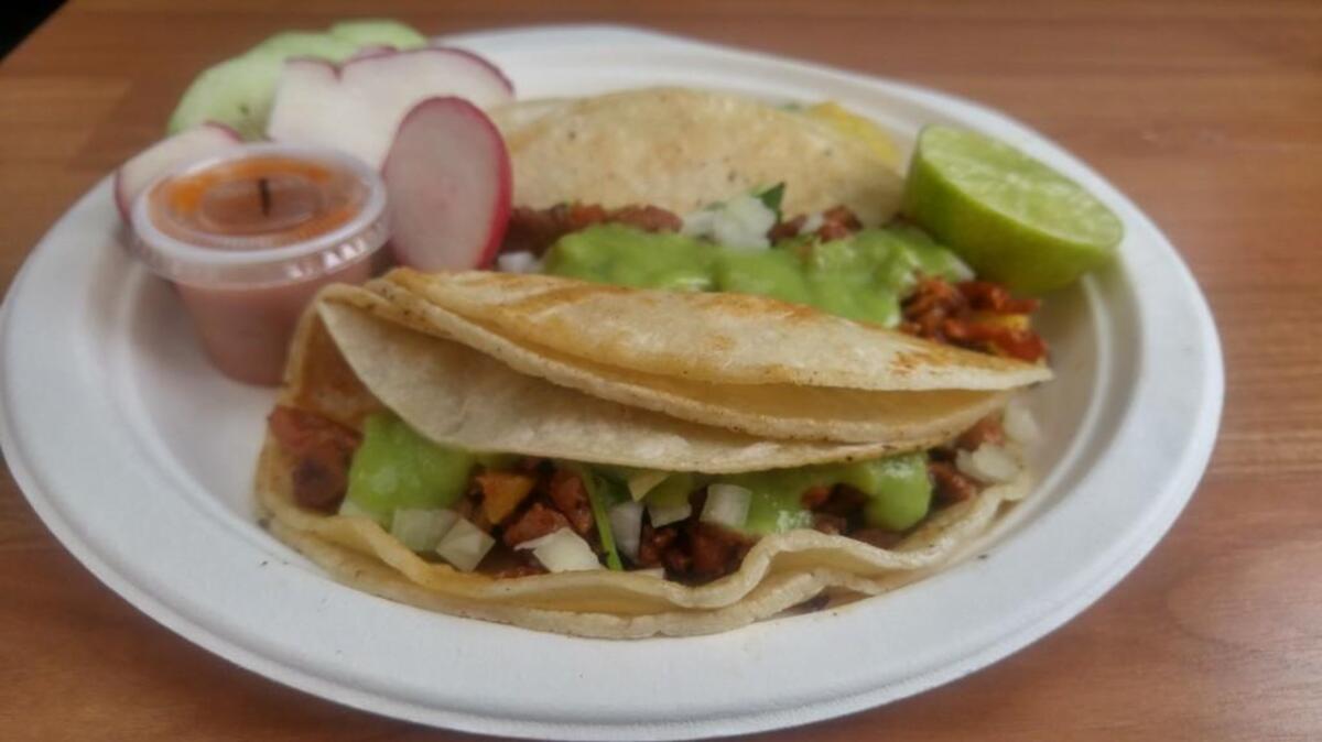 Three tacos, with al pastor meat, from Taqueria Sinaloa.