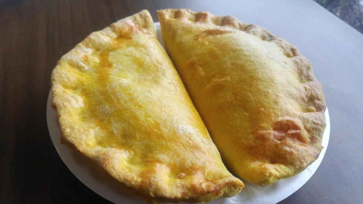A half moon pie from Polynesian Favorites, a bakery and steam-table deli in East Tacoma that opened in February. The pie comes with a sticky pineapple filling.