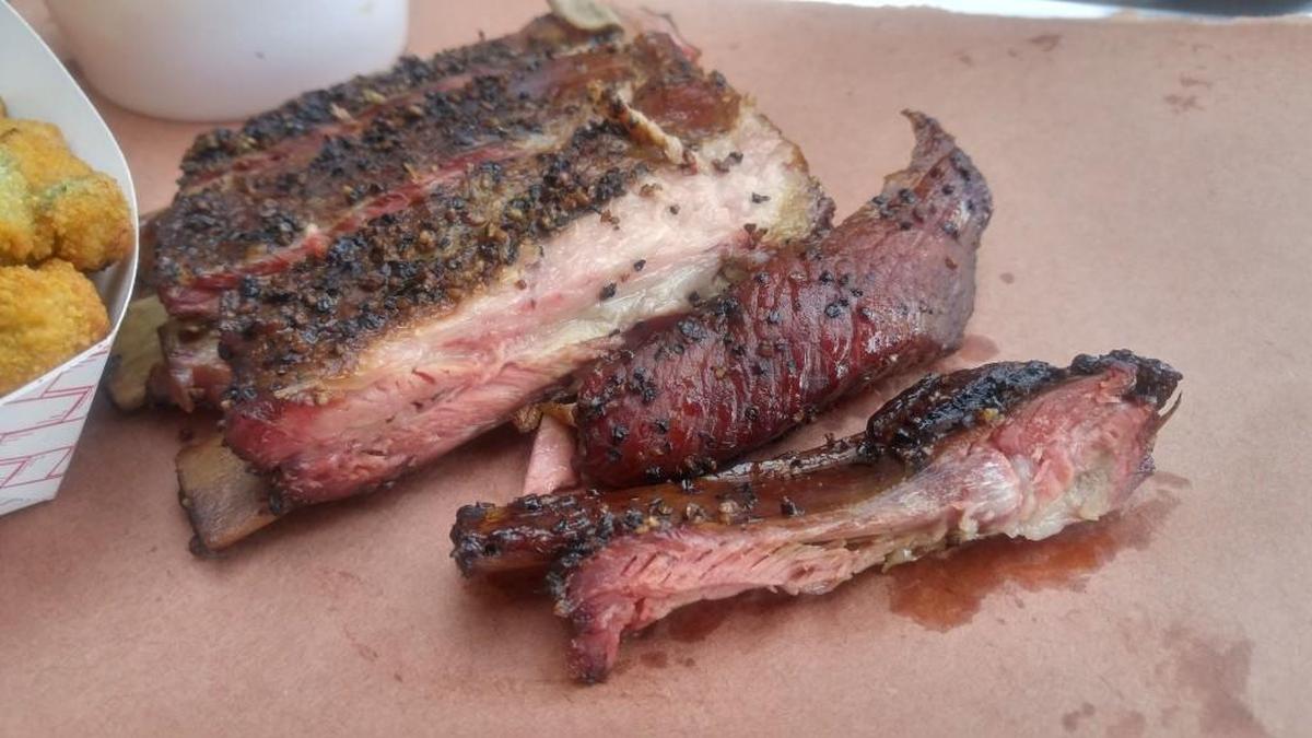 Ribs are rubbed with a simple salt-and-pepper based seasoning at BBQ2U in Gig Harbor.