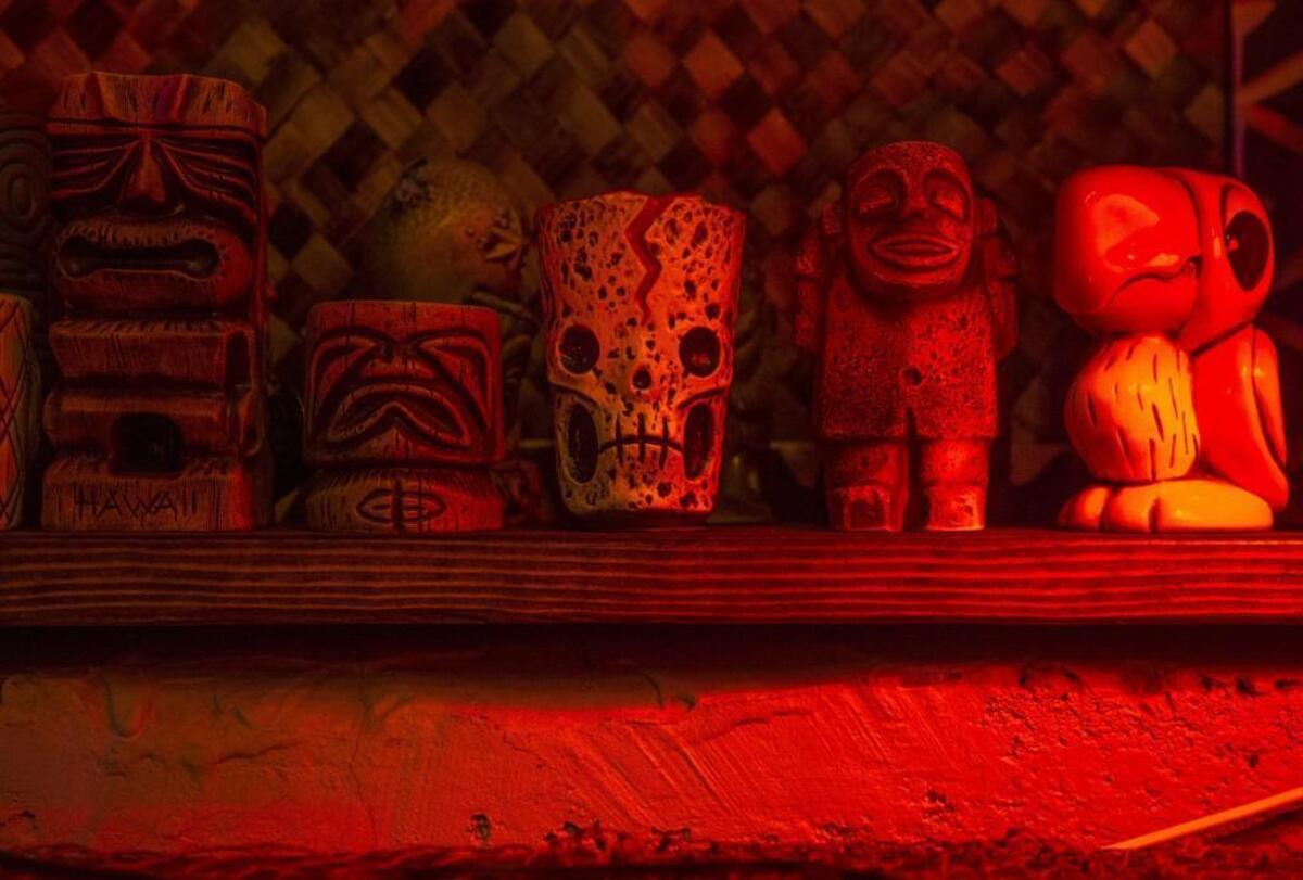 Tiki statues adorn the walls of Devil's Reef in Tacoma.
