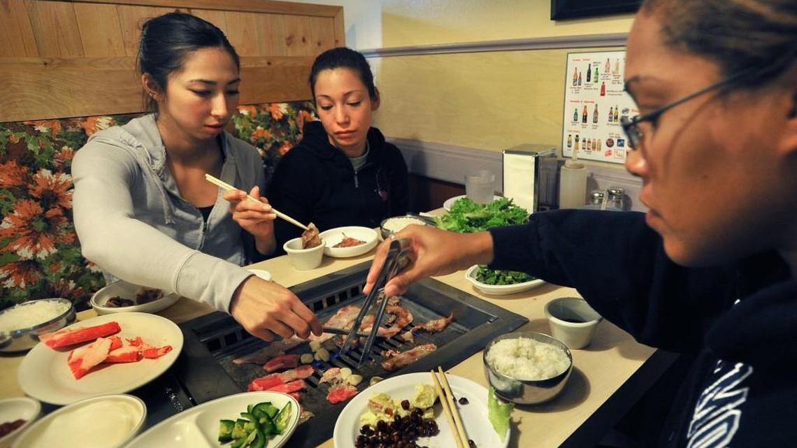 Diners grill meat at their table at a Korean barbecue restaurant in Lakewood, Wash. A new Boise restaurant will be the first in Idaho to offer a similar cook-at-your-table Korean BBQ experience.