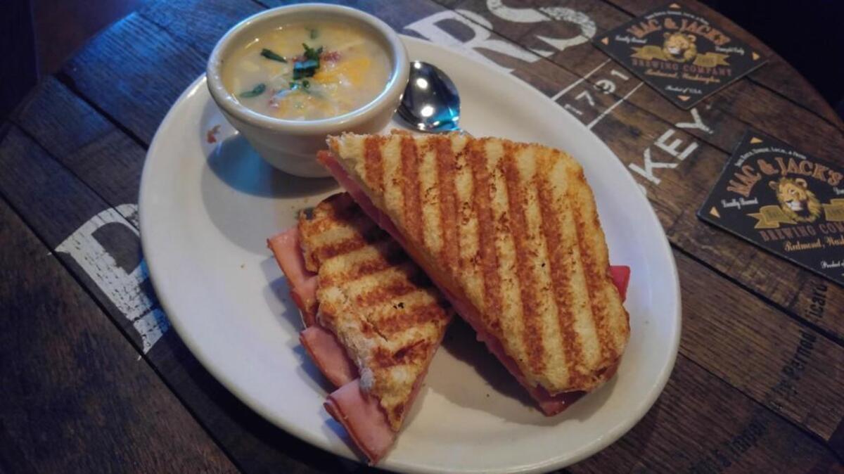 Pictured here is a panini sandwich with ham, cheddar and roasted red peppers from Flanagan’s Craft Pub in downtown Puyallup. On the side was baked potato soup.