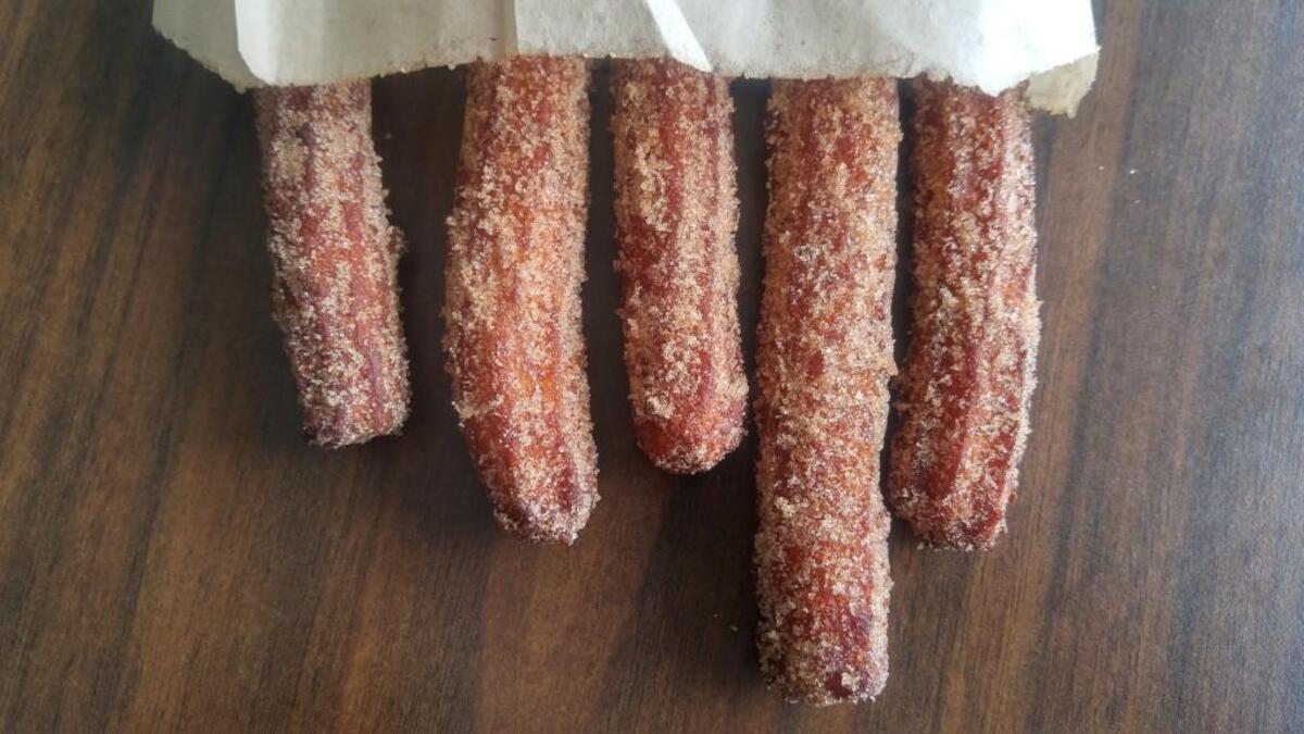 The churros at Brewers Row are dusted with a lot of cinnamon sugar.