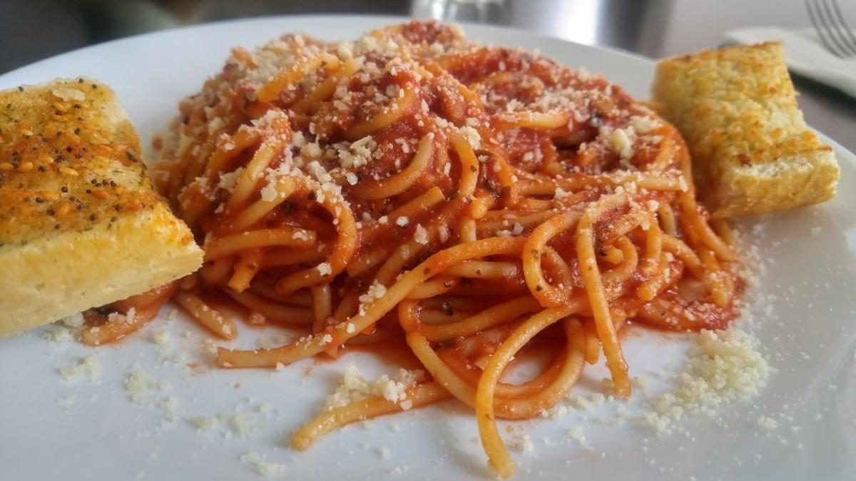 A lunch-sized portion of spaghetti with red sauce from The Lasagna Store, Pasta & More.