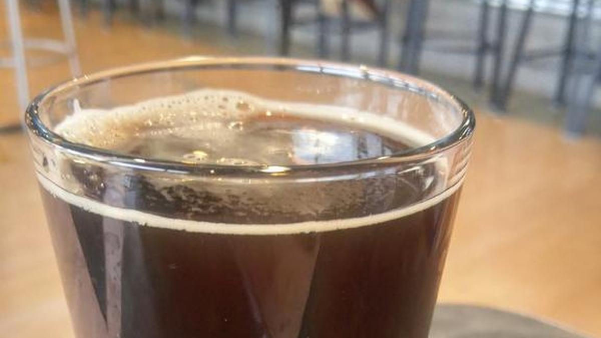 A glass of Ponderosa Porter from Lost Woods Brewery.