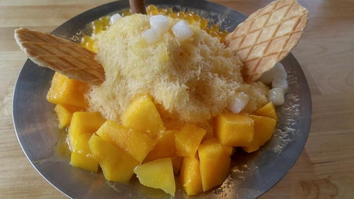 Shaved ice comes in six flavors at Aloha Poke in Fircrest. This one is mango topped with fresh fruit and mango boba.