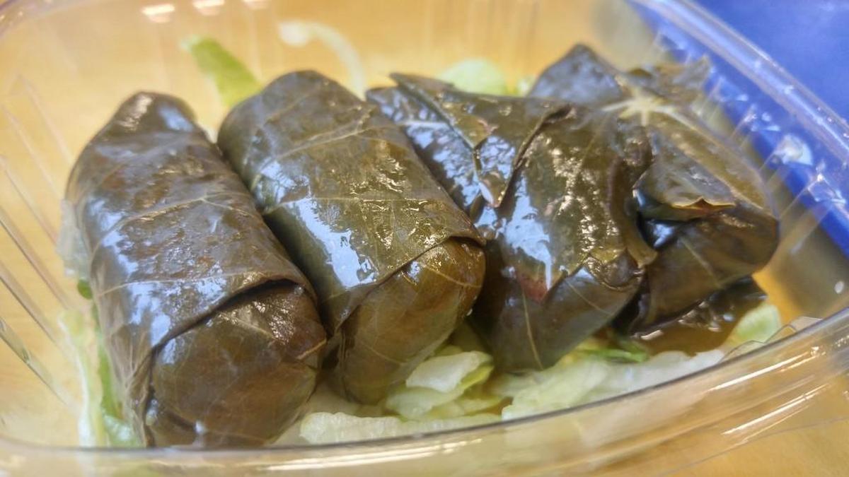 An order of dolmades, grape leaves stuffed with seasoned rice, from D’Lara Mediterranean Grill.