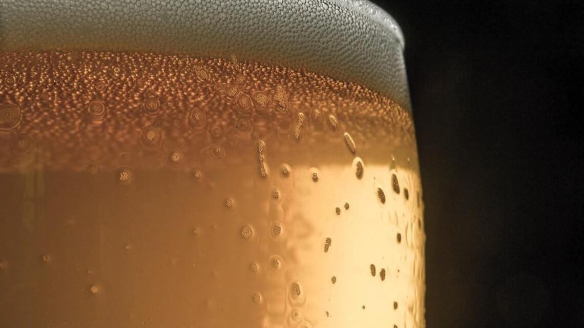 Gig Harbor's newest taproom comes with gourmet hot dogs, pizza and a golf driving range