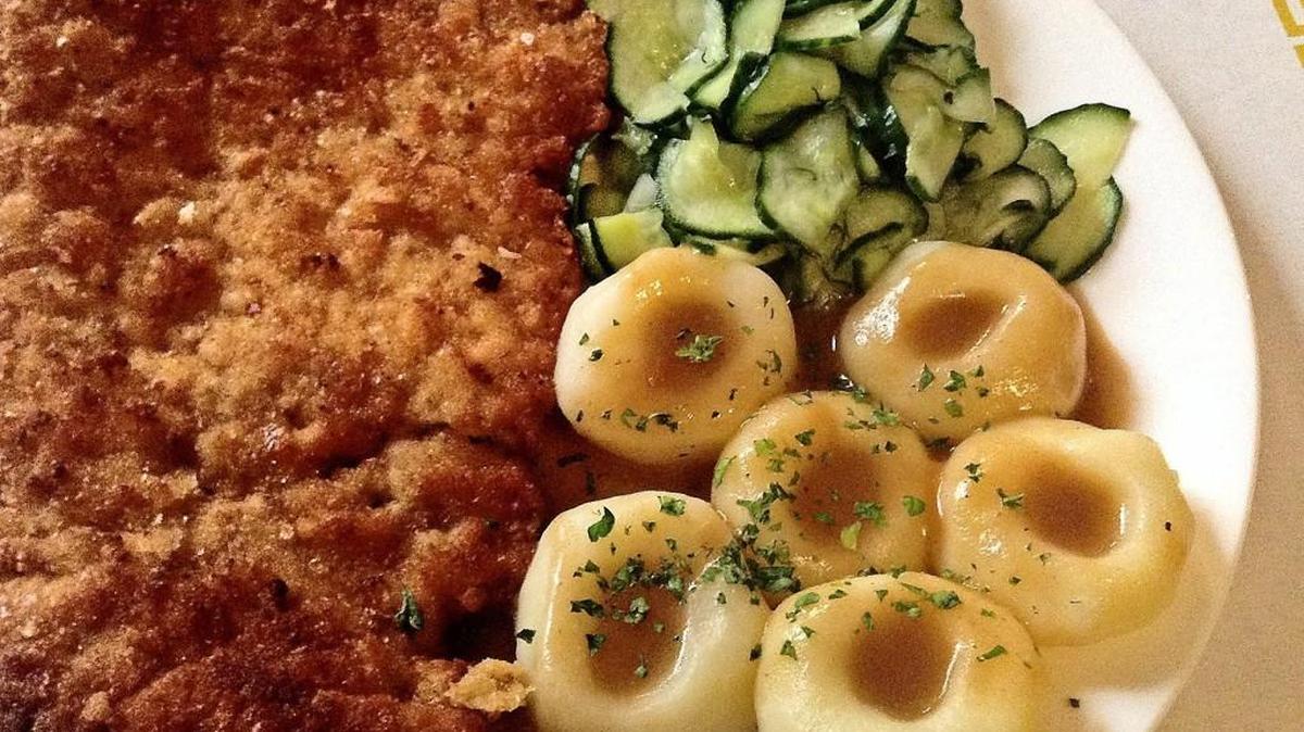A tender pork cutlet is coated in a crunchy jacket and fried. It came with cucumber salad and dumplings coated in gravy at Bruno’s European Restaurant in Lakewood.