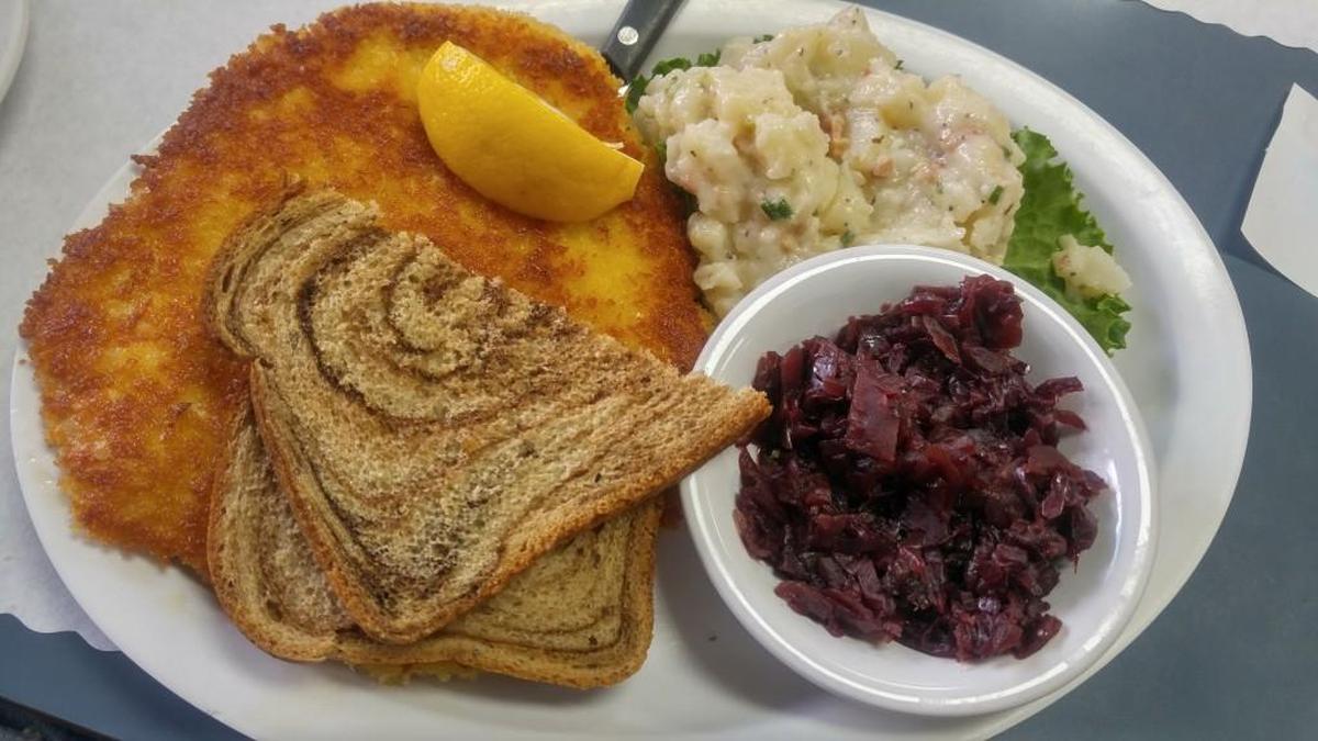 Mary Mary’s Cafe serves its schnitzel with rye bread, soup or salad, red cabbage and potato salad.
