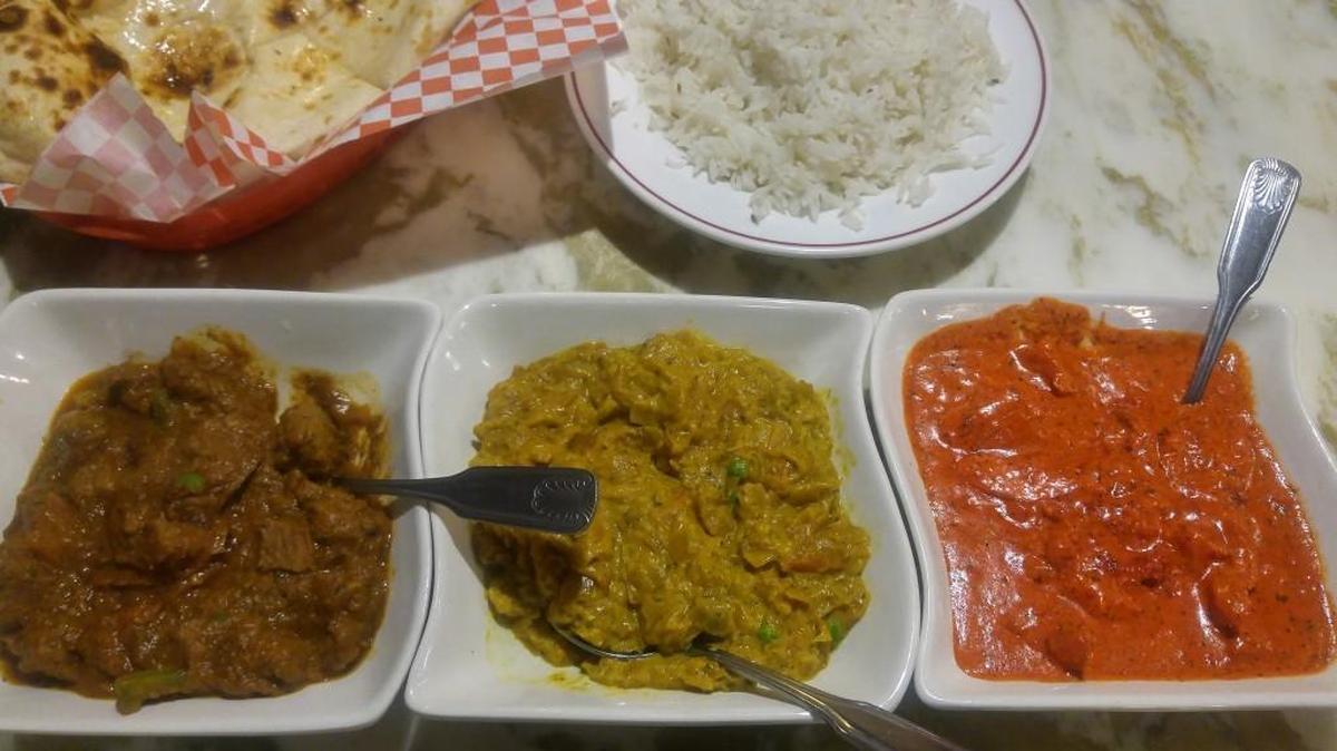 A dinner-for-two with lamb curry, bharta and butter chicken. It also comes with rice and naan at Karma Indian Cuisine in South Hill.