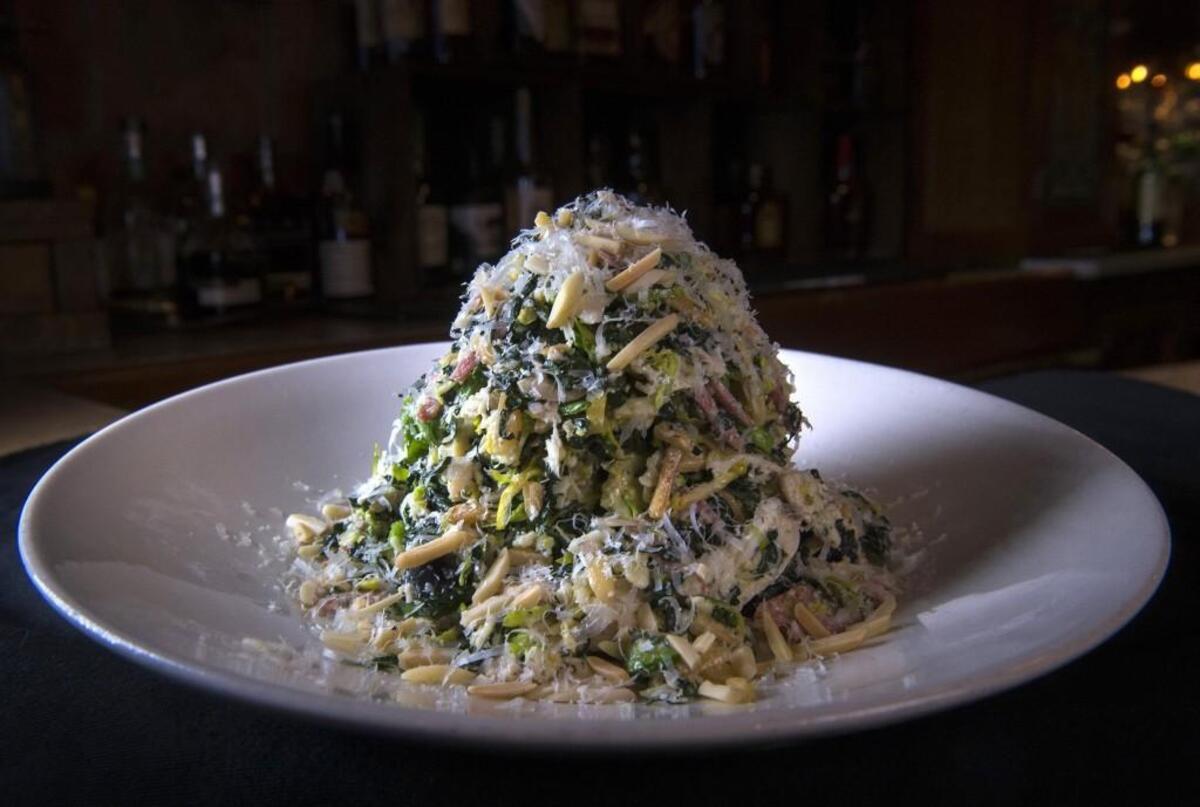 A kale and shaved Brussels sprouts salad with a lemon-herb vinaigrette at Crockett’s Public House in Puyallup.