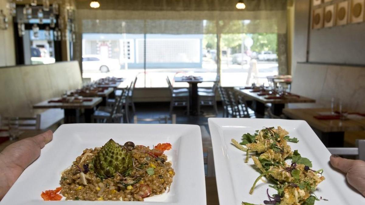 At Marrow, on Sixth Avenue in Tacoma, farrotto on the left, and Oregonzola fried squash blossoms at right. They were featured on the restaurant’s vegetarian menu. The restaurant opened in 2011. .