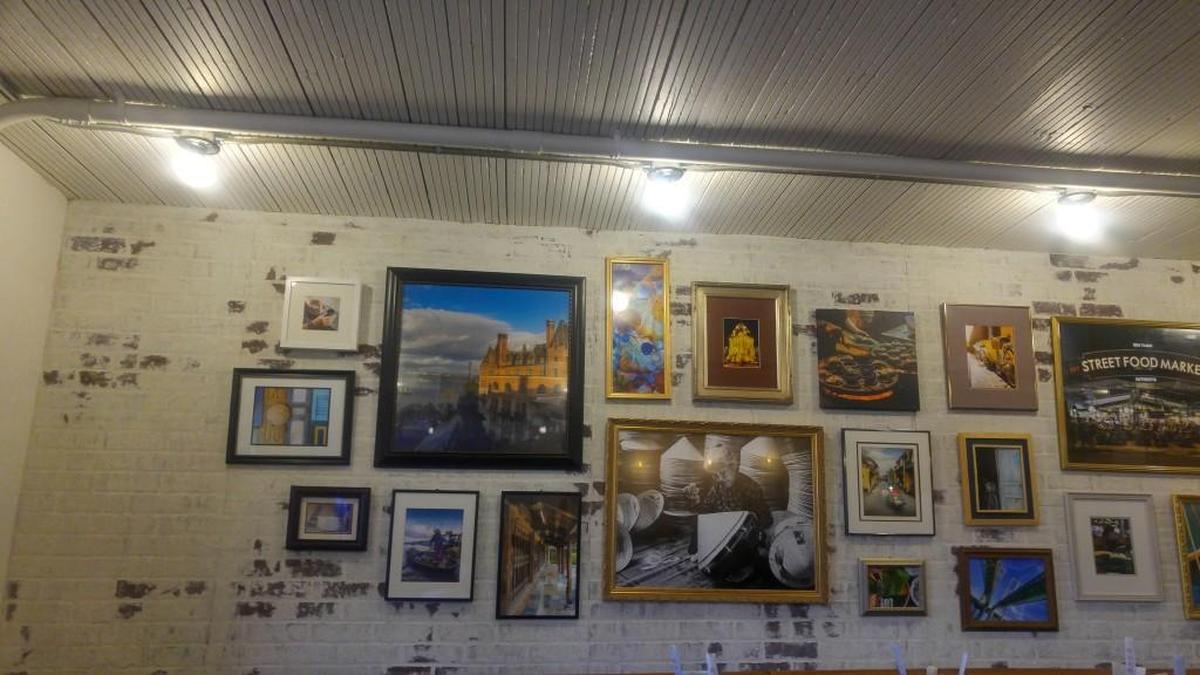 A grouping of photos in the dining room at La Cà Bar.