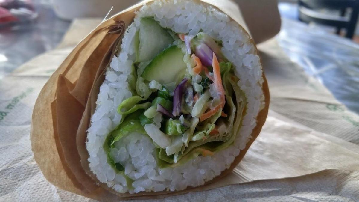A build-your-own sushirito with fried shrimp, avocado and a lot of other things.