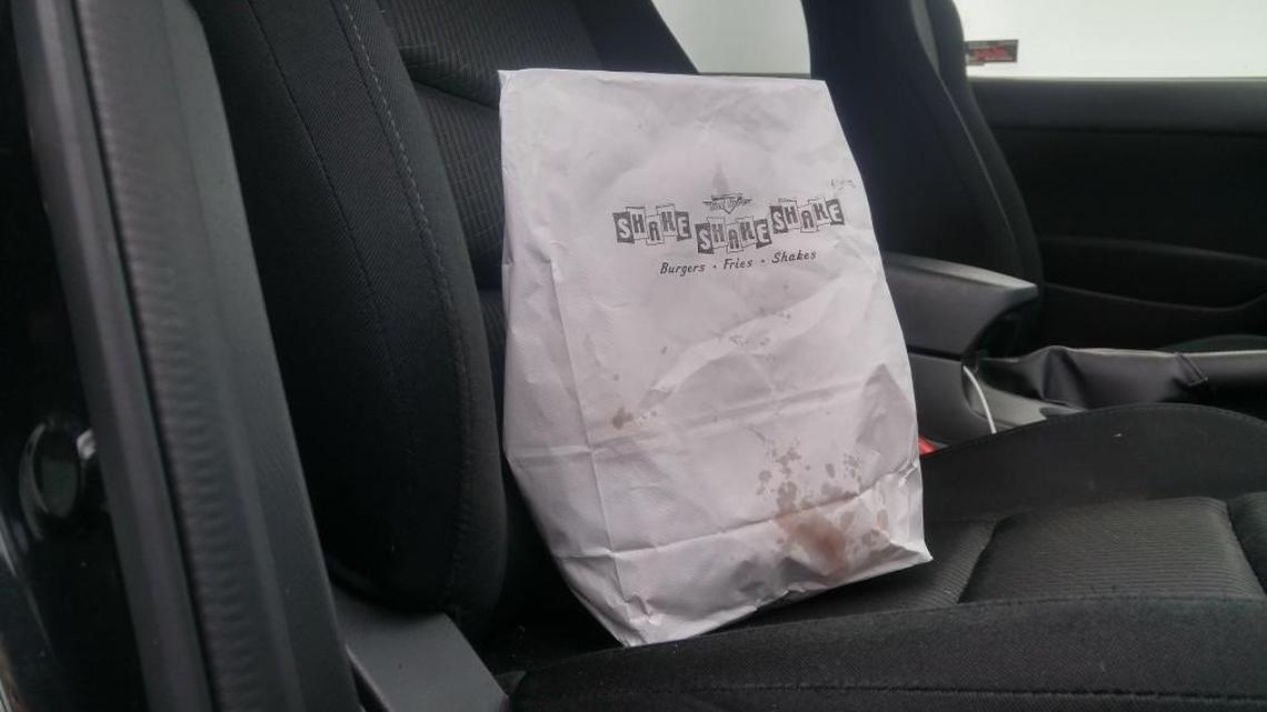 Pretty soon, this bag of hot burgers and fries from Shake Shake Shake can be delivered to your house or office when UberEats launches in Tacoma.