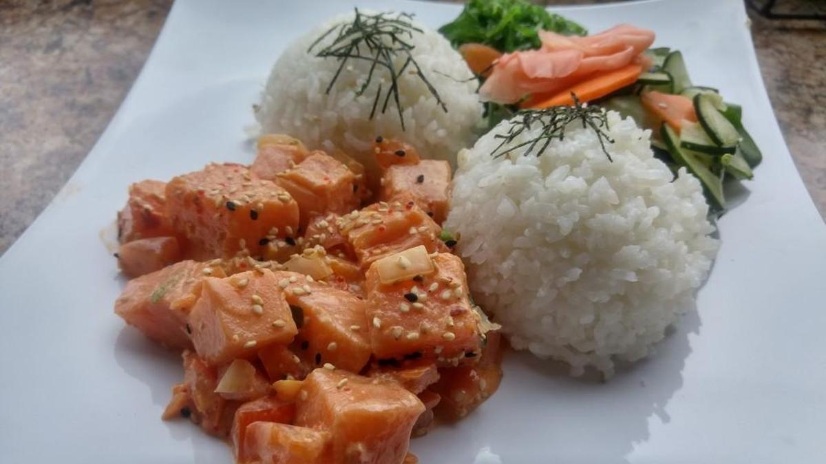 Spicy salmon poke with rice and a salad from downtown Tacoma’s Sam Choy’s Poke to the Max.