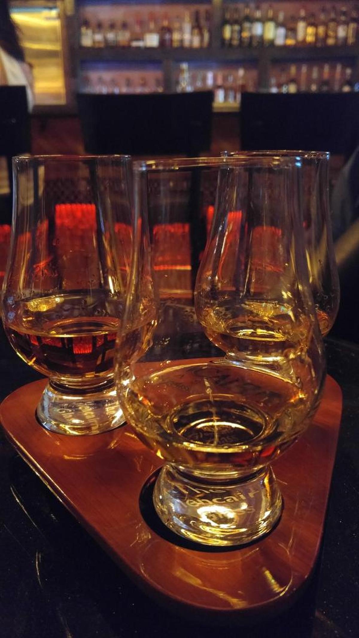 A whiskey flight is one of four offered at The Speakeasy Lounge in South Hill.