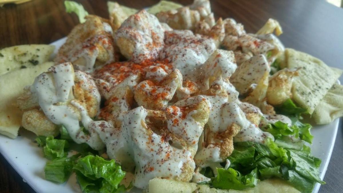 Fried cauliflower with pita bread from Mediterranean Gyro Grill in Federal Way. Similar menu items will be served at the University Place location.