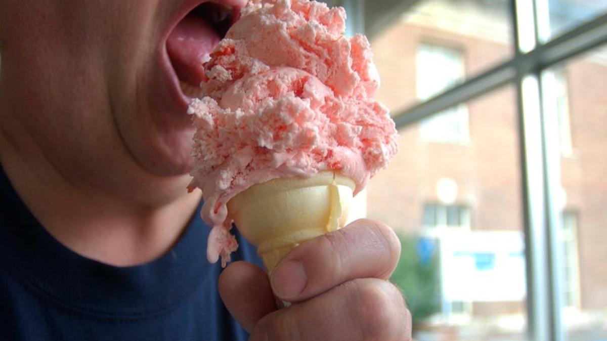1971 Penn State University Alumnus Curt Heintz eats an ice cream cone at the University Creamery on the Penn State campus.