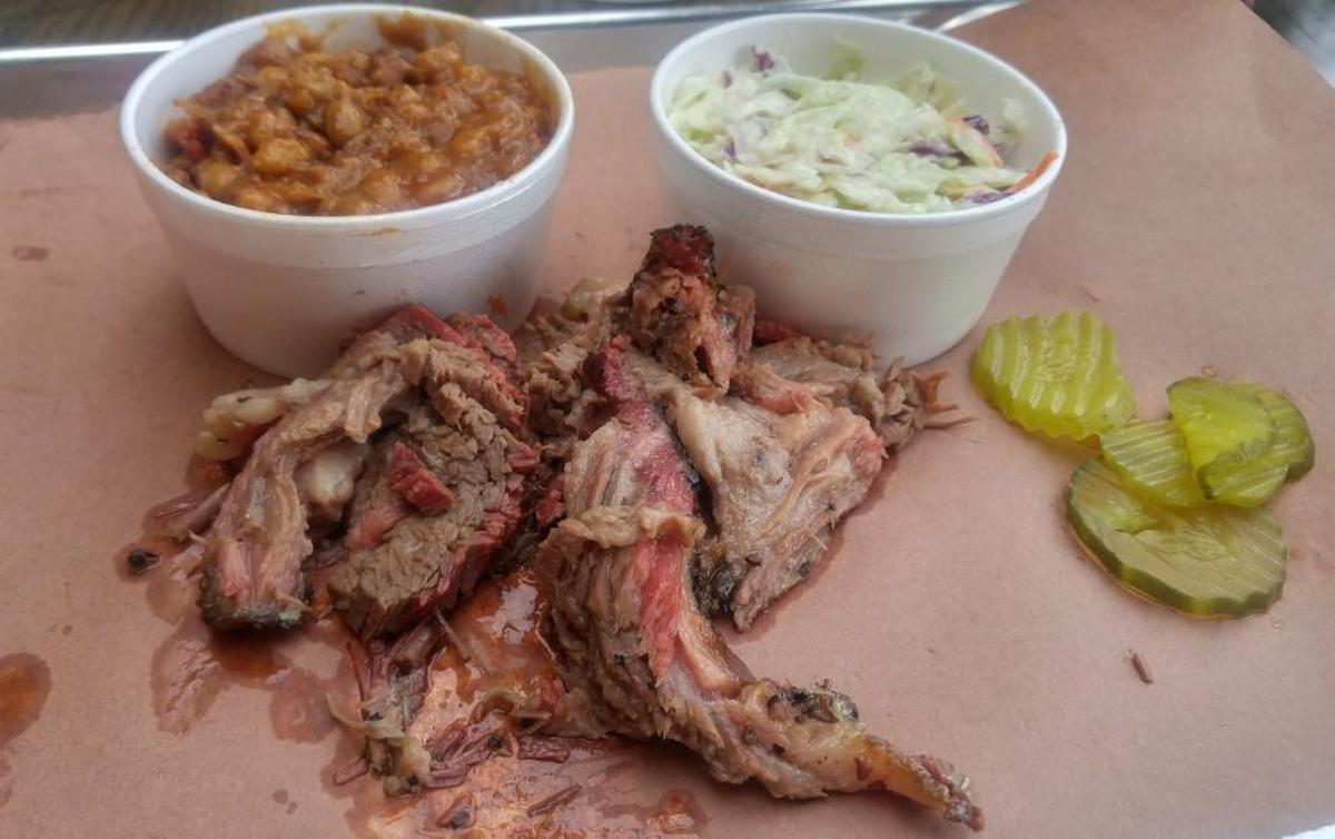 A brisket plate with beans and cole slaw, plus dill pickle chips, from BBQ2U in Gig Harbor.